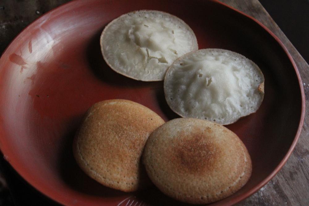 Appams on a terracotta plate
